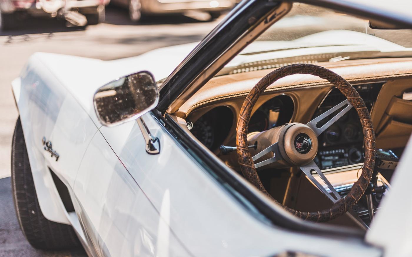 Vintage white car with tan interior