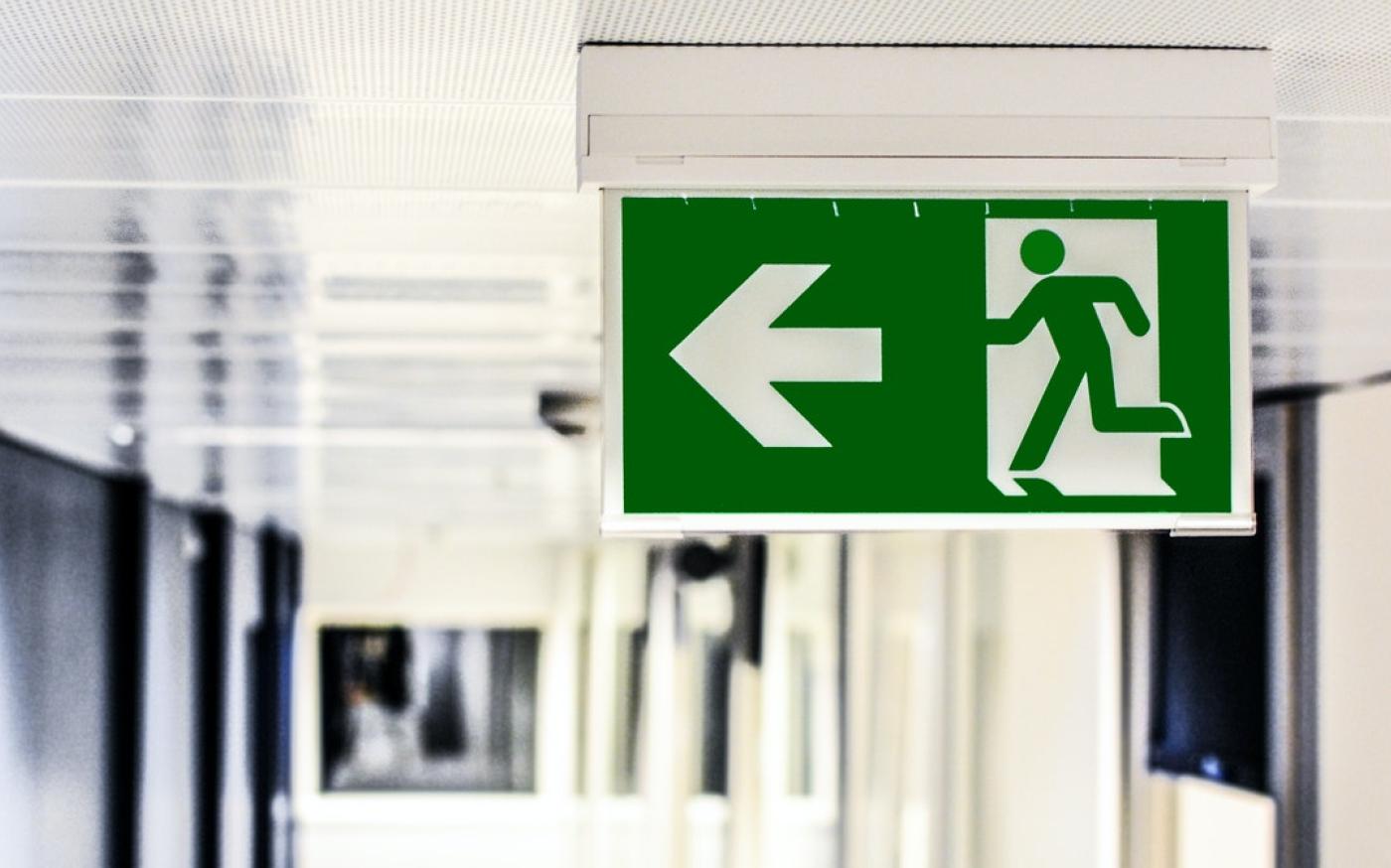 An exit sign in a modern office building